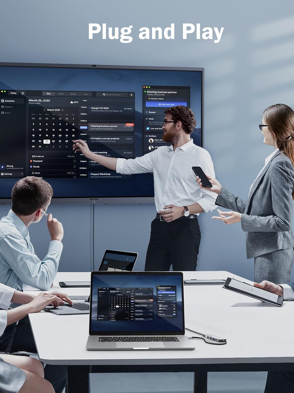 Group of people in a meeting room with technology equipment, emphasizing 'Plug and Play'.