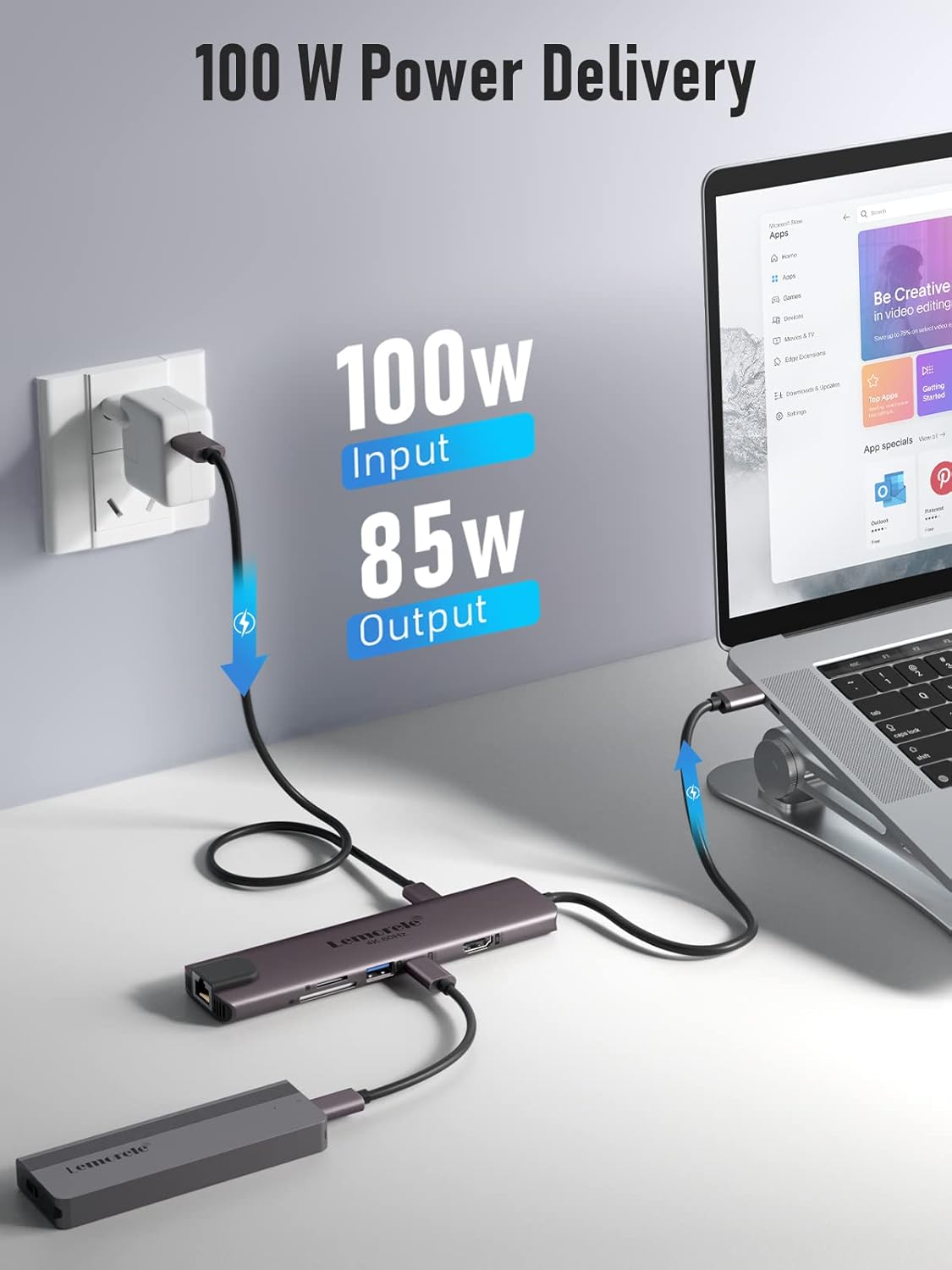 Laptop with USB-C hub connected, showing power delivery details on a light gray background.