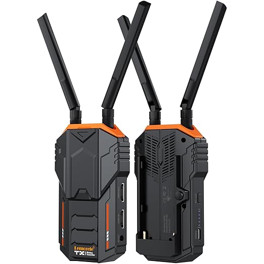 Two black and orange wireless routers with antennas on a white background