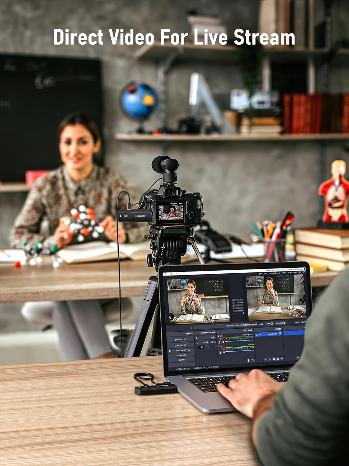 Person recording a video stream with camera and laptop in a classroom setting