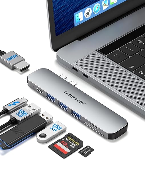 Multiport adapter with USB-C cable, card reader, and laptop on a white background