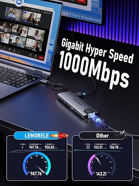 Laptop with USB-C hub displaying Gigabit Hyper Speed 1000Mbps on a dark background.