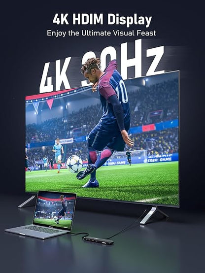 Large screen displaying a soccer game with '4K HDIM Display' text, laptop below showing same content.