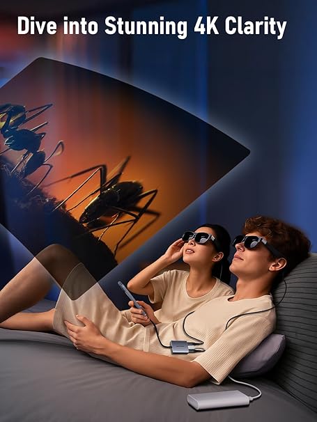 Two people watching a movie on a large screen with text 'Dive into Stunning 4K Clarity'.