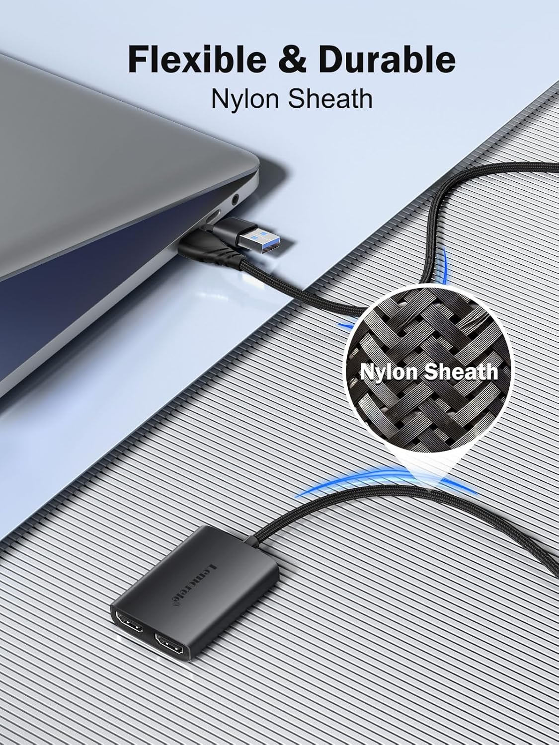 USB cable with a flexible and durable nylon sheath, connected to a laptop.